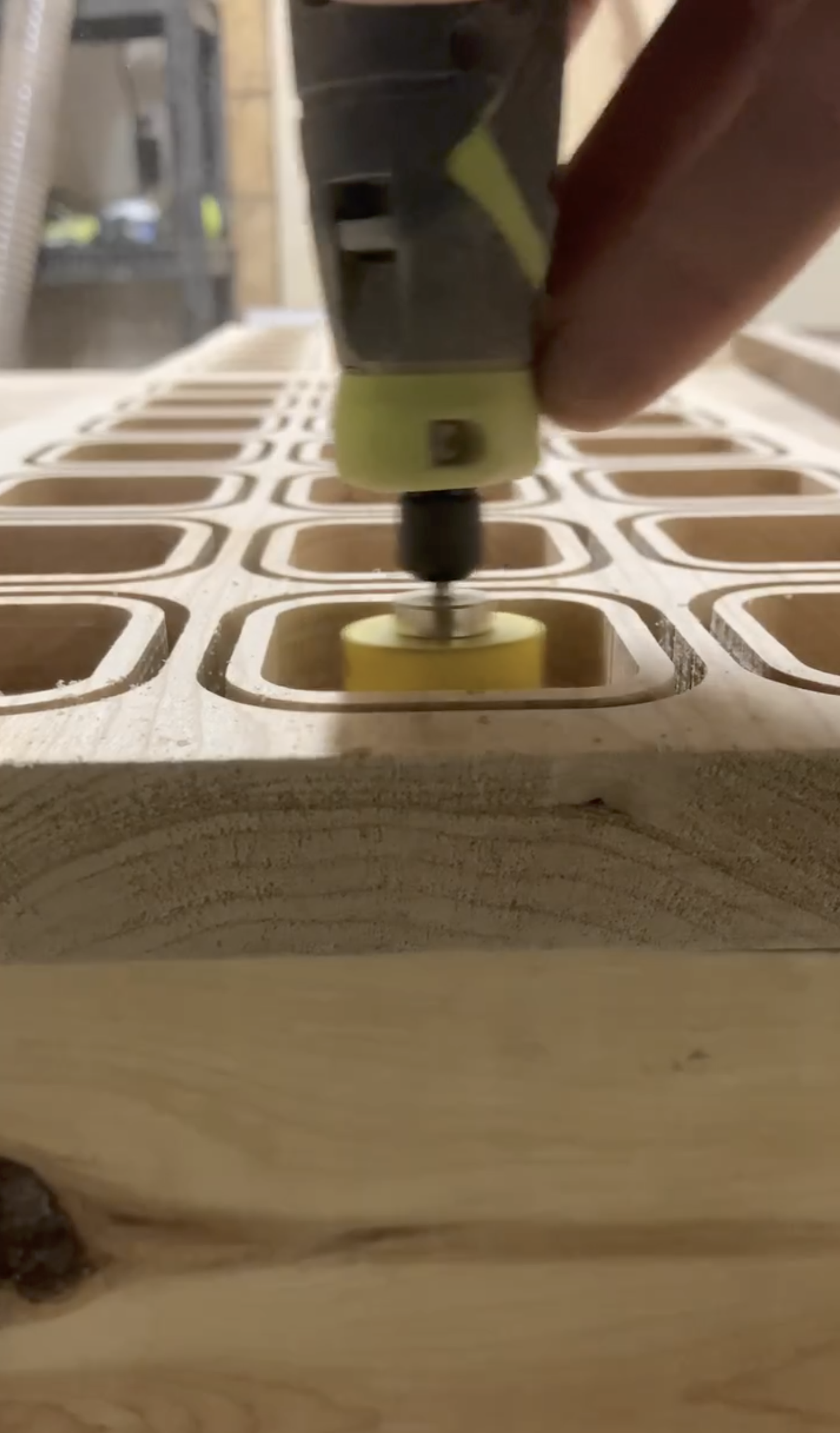 Early Timber Box Design workshop sanding wood trays.